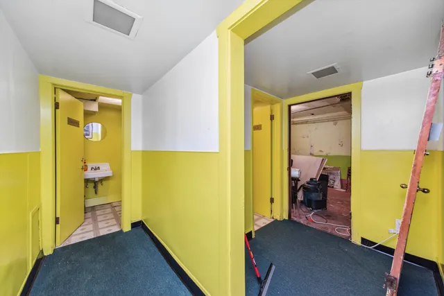 a view of bedroom with a bed and wooden floor