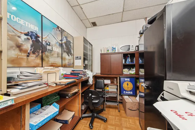 a very nice looking room with many windows and furniture