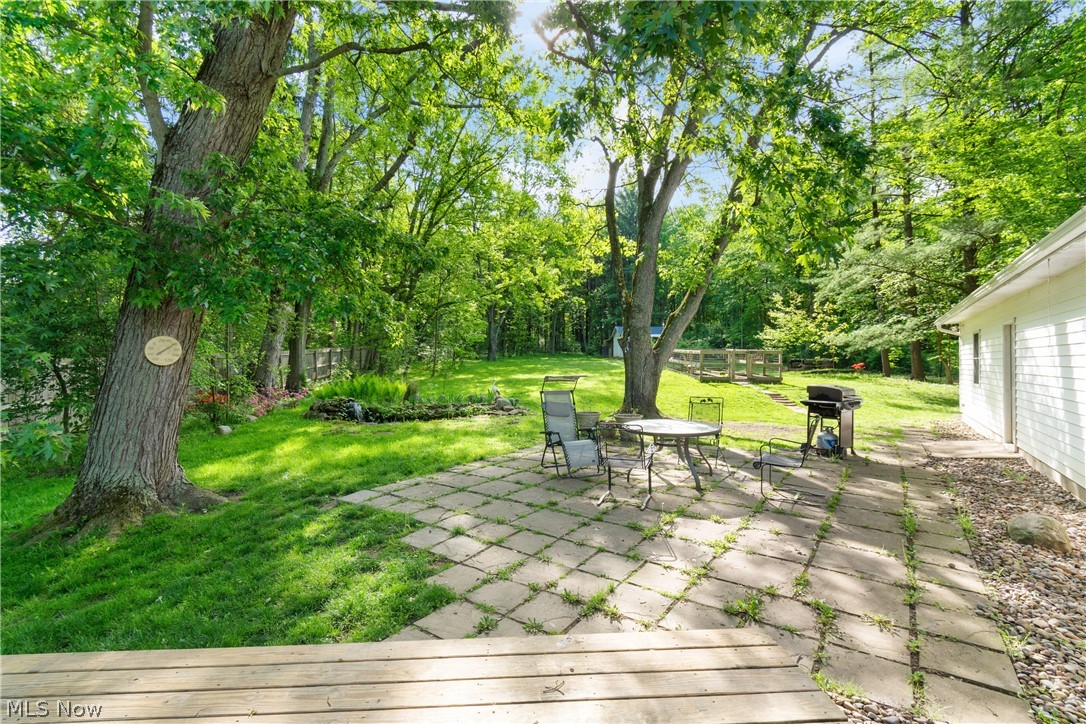 3255 Old Weymouth Road Medina, OH 44256 - Photo 24 of 31 Wooden deck with a patio area and a lawn