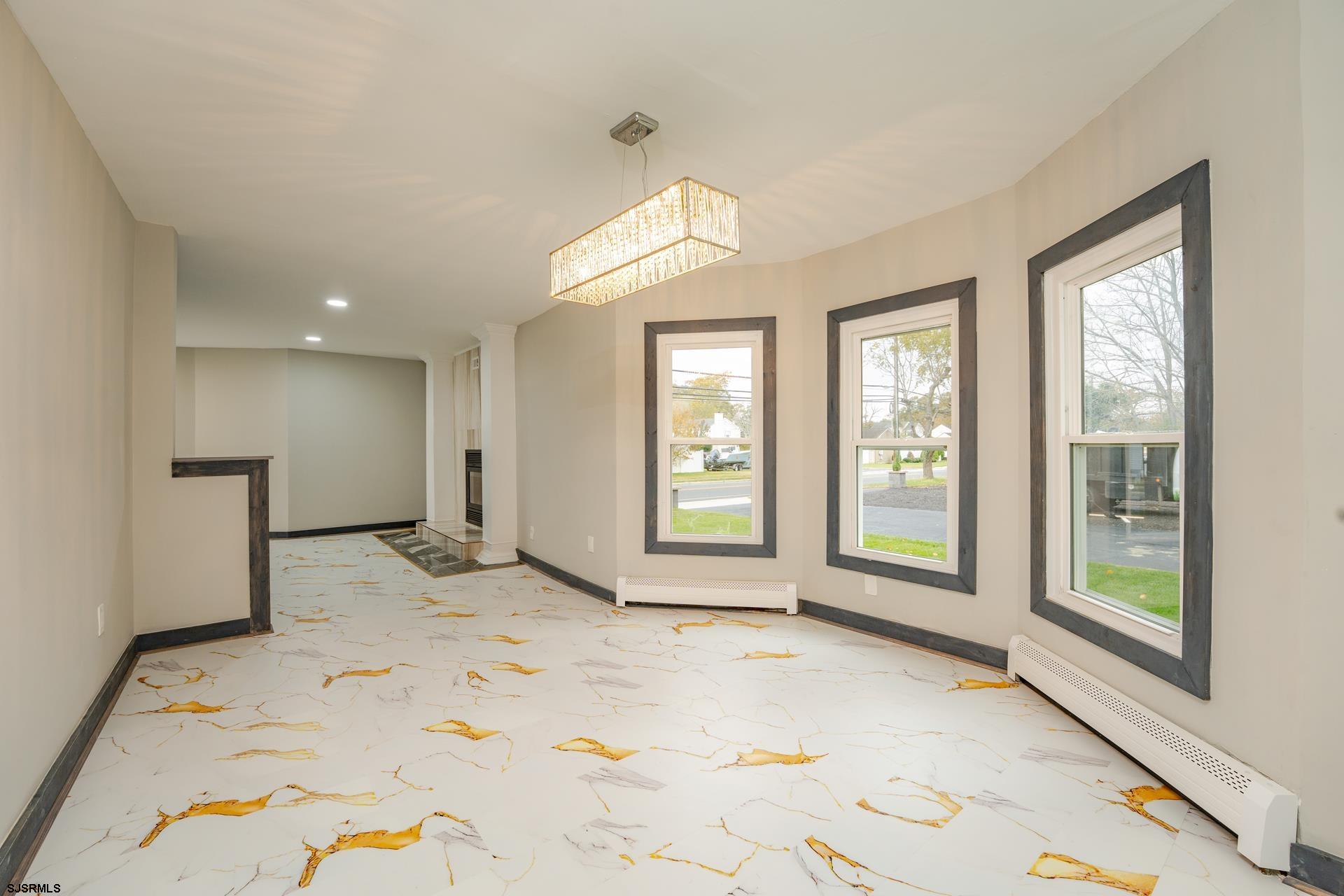 1203 West Mill Road Northfield, NJ 08225 - Photo 7 of 90 a view of a room with a large window