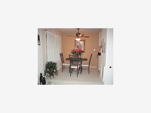 100 East Middlefield Road, Unit 6F Mountain View, CA 94043 - Photo 4 of 9 a living room with furniture and flowers