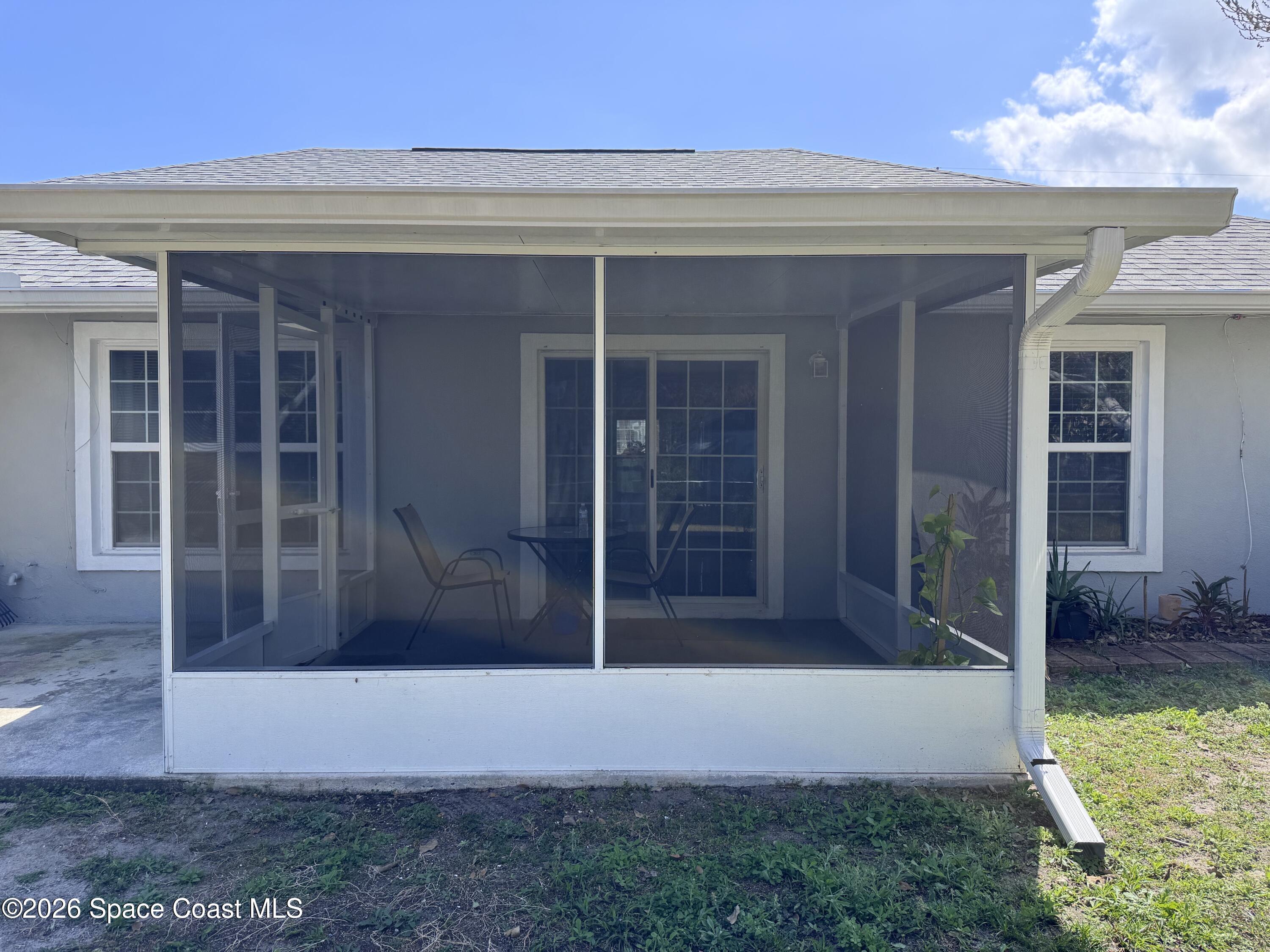 2595 3rd Avenue Northeast Palm Bay, FL 32905 - Photo 15 of 17 front view of a house with a yard