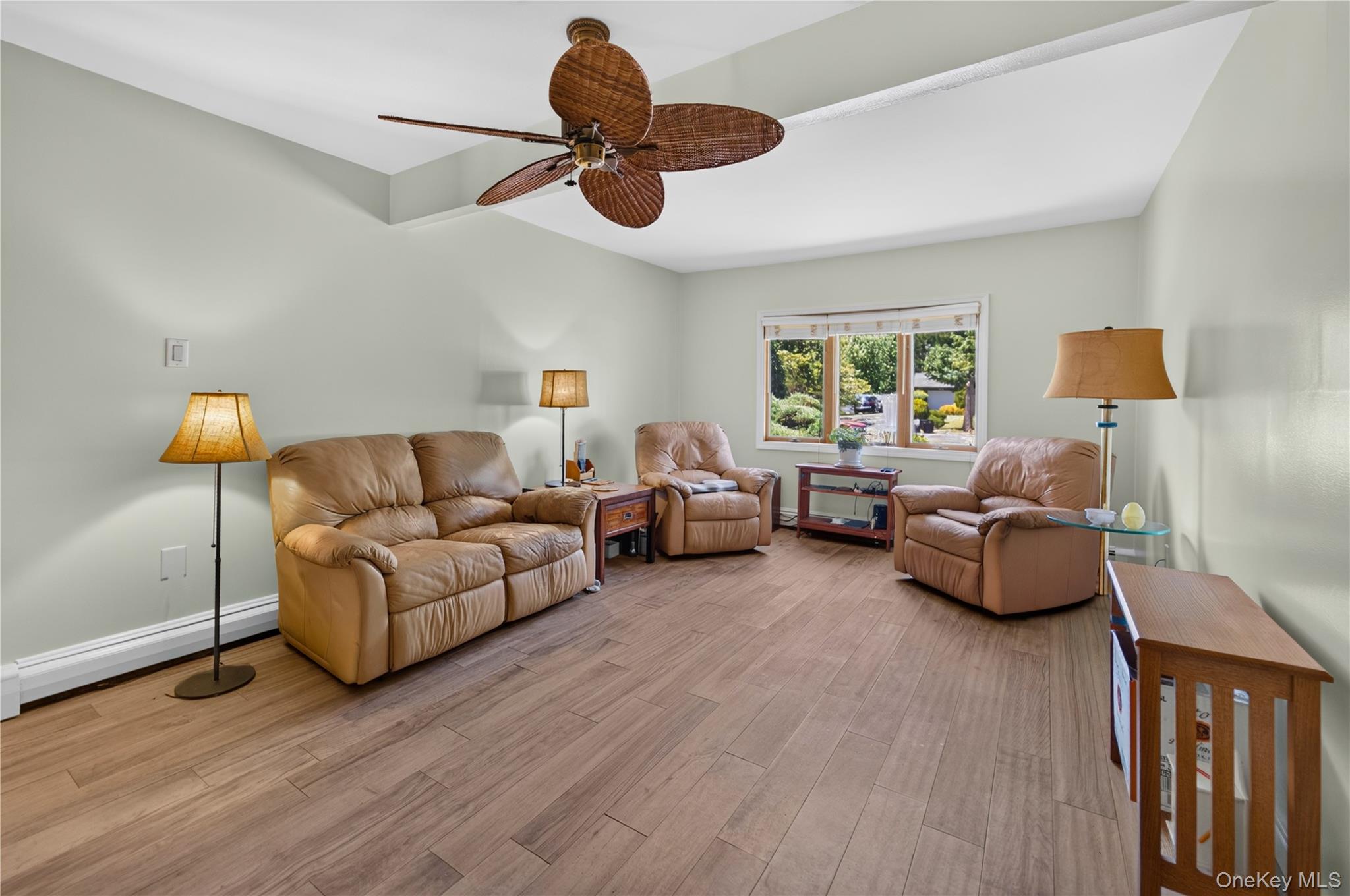 261 Hallock Road Stony Brook, NY 11790 - Photo 6 of 13 a living room with furniture and a large window