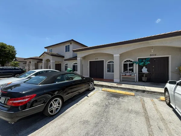 a car parked in front of a house