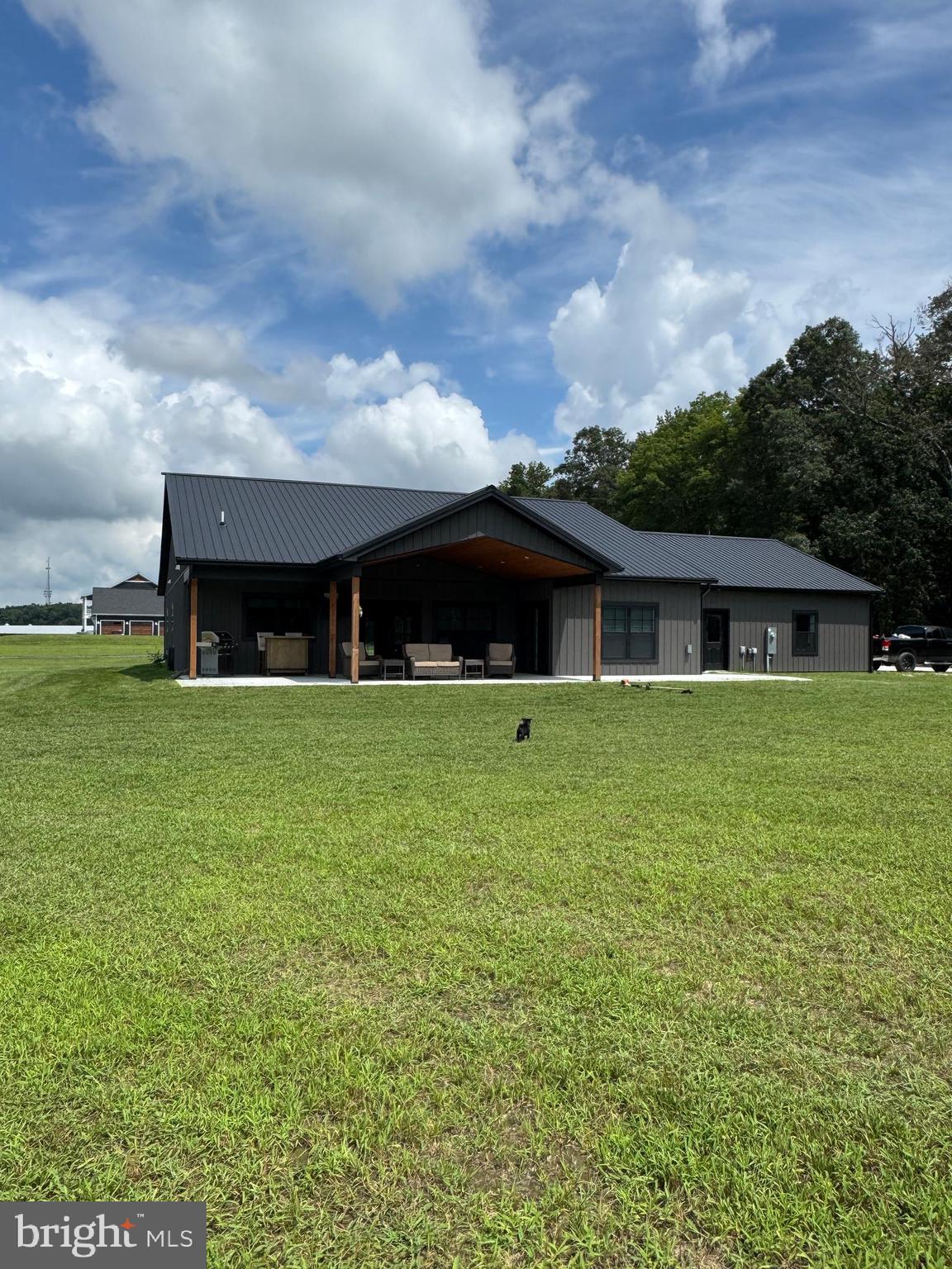 26067 Goldsboro Road Goldsboro, MD 21636 - Photo 1 of 21 a front view of house with yard and green space