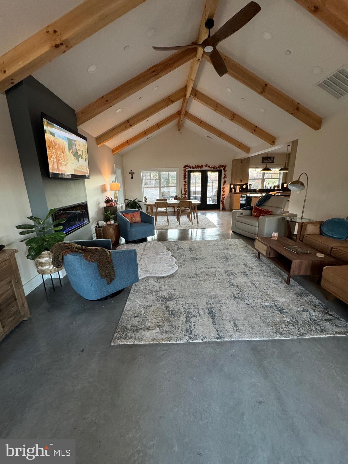 26067 Goldsboro Road Goldsboro, MD 21636 - Photo 13 of 21 a living room with furniture and a flat screen tv
