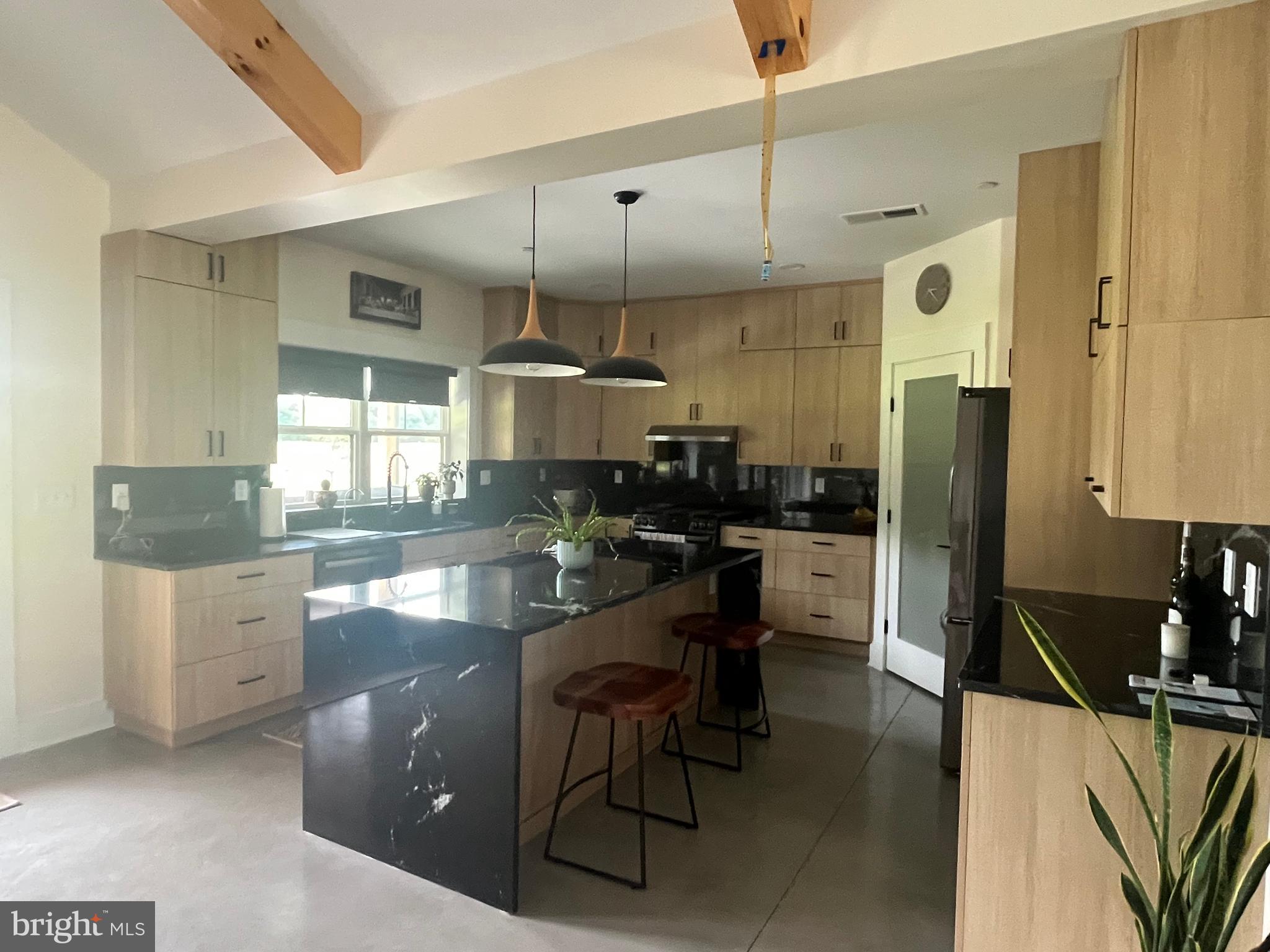26067 Goldsboro Road Goldsboro, MD 21636 - Photo 16 of 21 a kitchen with granite countertop a sink cabinets and stainless steel appliances