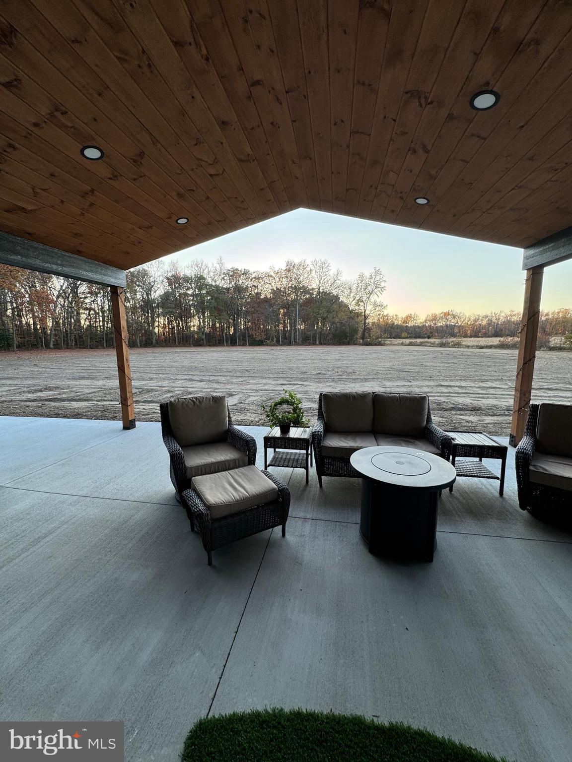 26067 Goldsboro Road Goldsboro, MD 21636 - Photo 6 of 21 a outdoor living space with patio furniture and a potted plant