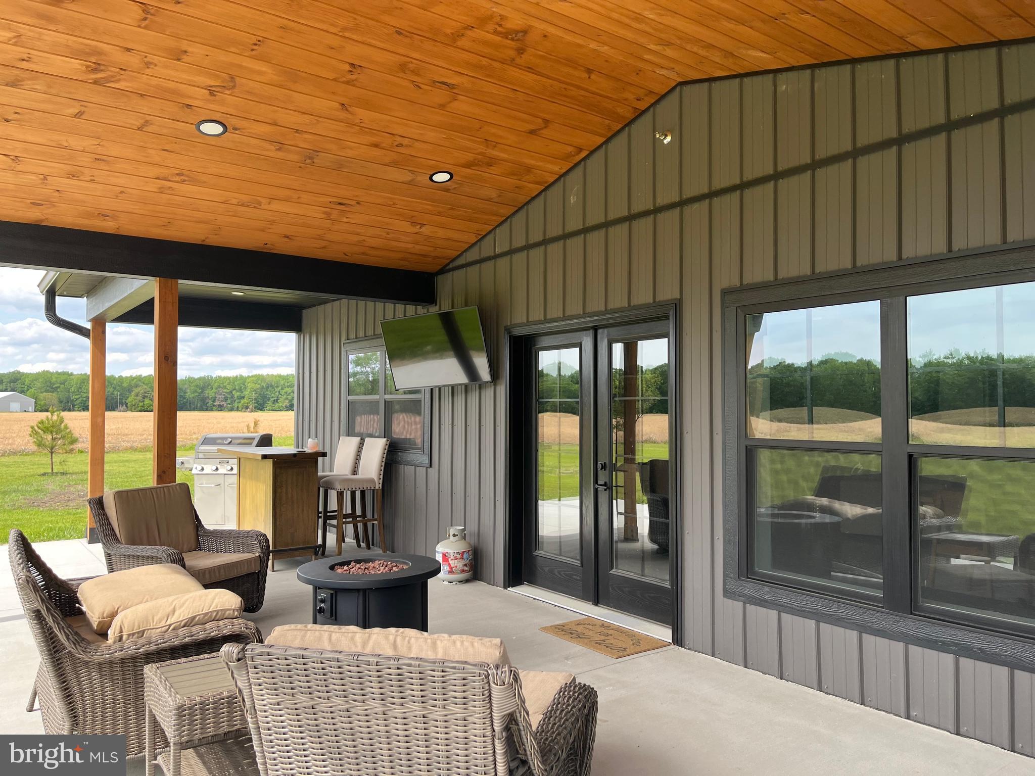 26067 Goldsboro Road Goldsboro, MD 21636 - Photo 7 of 21 a living room with furniture a large window with outer view