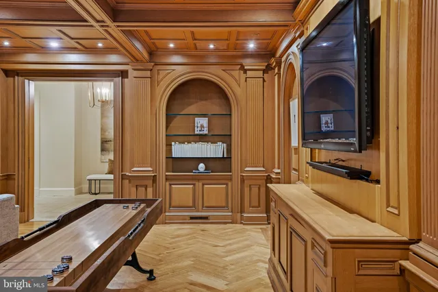 a large white kitchen with a sink and dishwasher