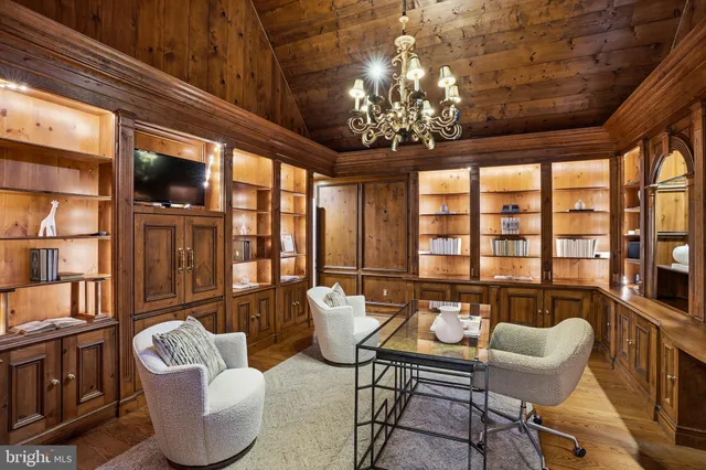 a view of entryway and hall with a mirror