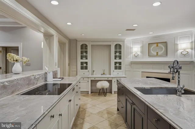 a kitchen with sink stove and refrigerator