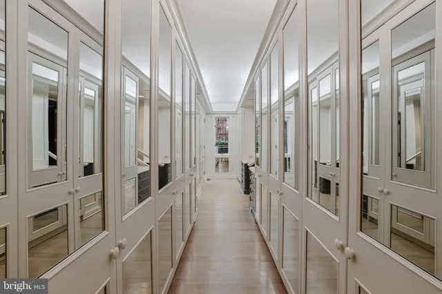 a spacious bathroom with a tub sink and mirror