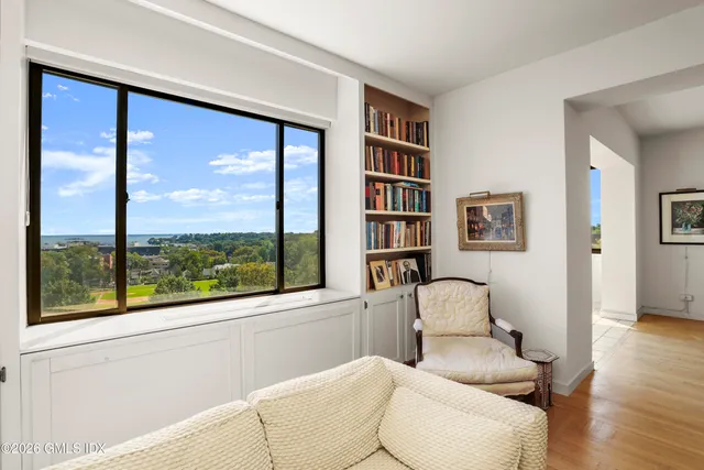 a living room with furniture and a window