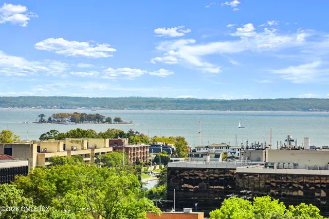 a view of a city with lawn chairs
