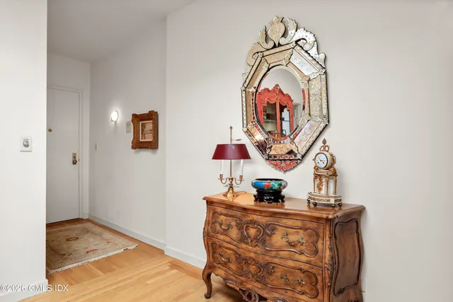 a bedroom with a bed and a mirror