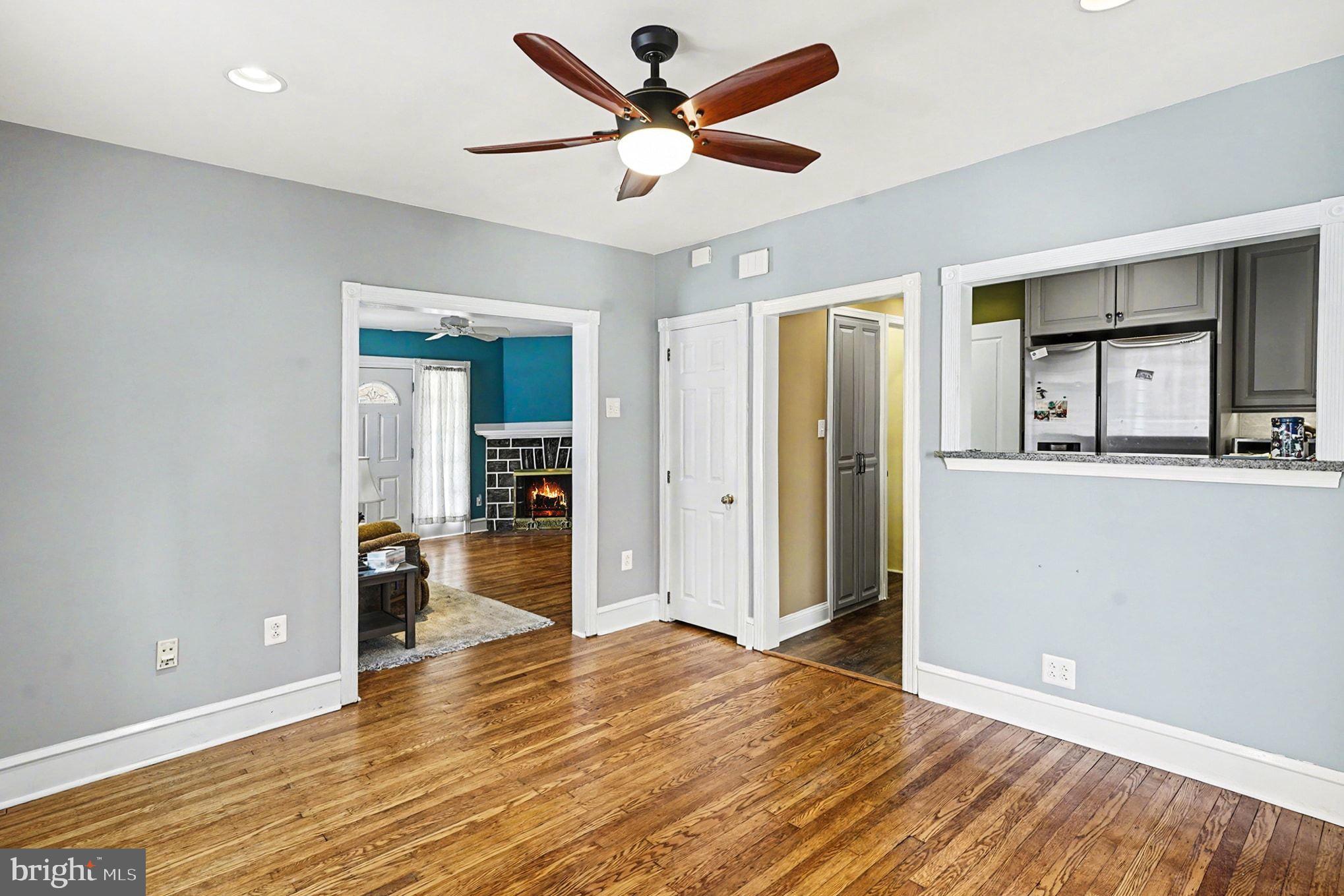 4031 Vernon Road Drexel Hill, PA 19026 - Photo 11 of 38 a view of a livingroom with wooden floor and a ceiling fan