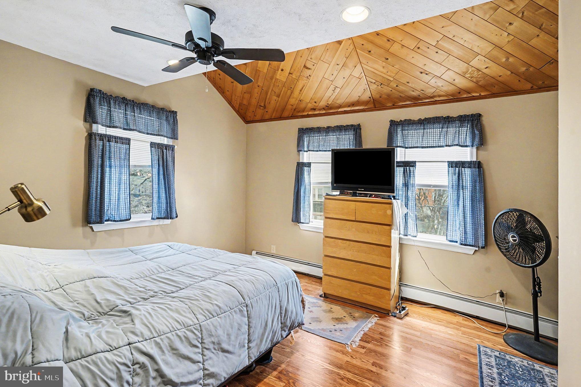 4031 Vernon Road Drexel Hill, PA 19026 - Photo 20 of 38 a bedroom with a bed and flat screen tv