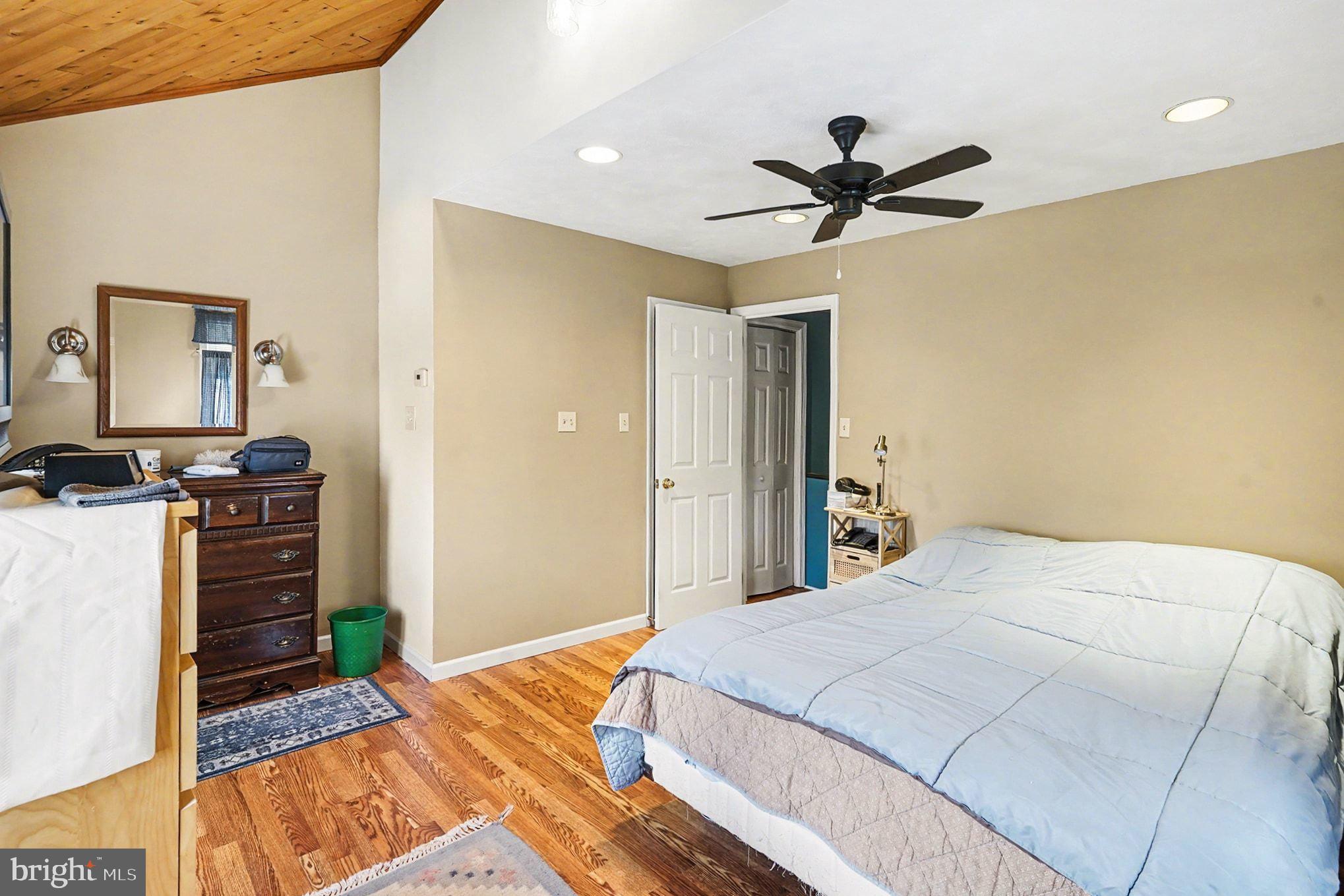 4031 Vernon Road Drexel Hill, PA 19026 - Photo 21 of 38 a bedroom with a bed and a chandelier