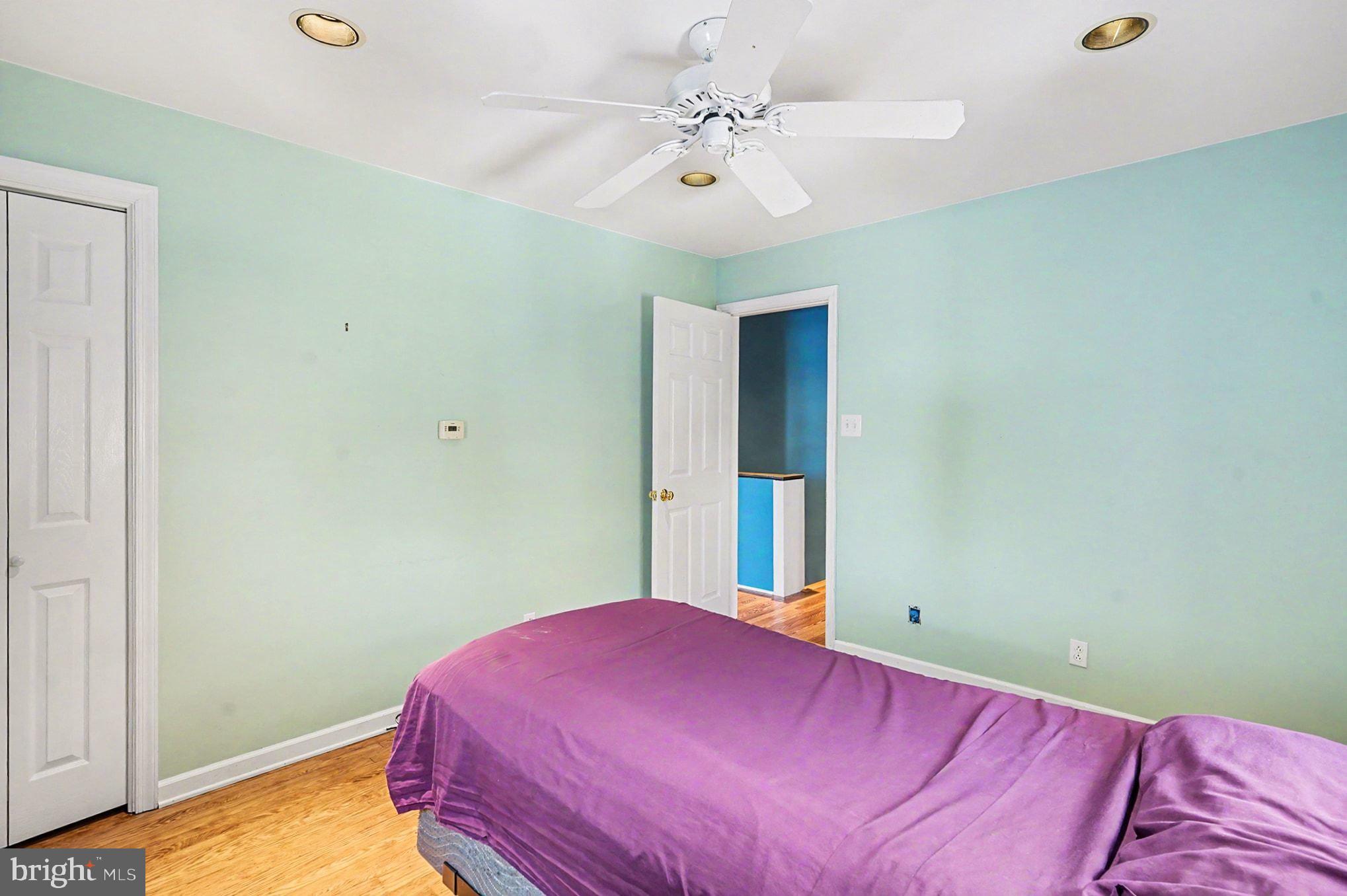4031 Vernon Road Drexel Hill, PA 19026 - Photo 22 of 38 a bedroom with a bed and a chandelier