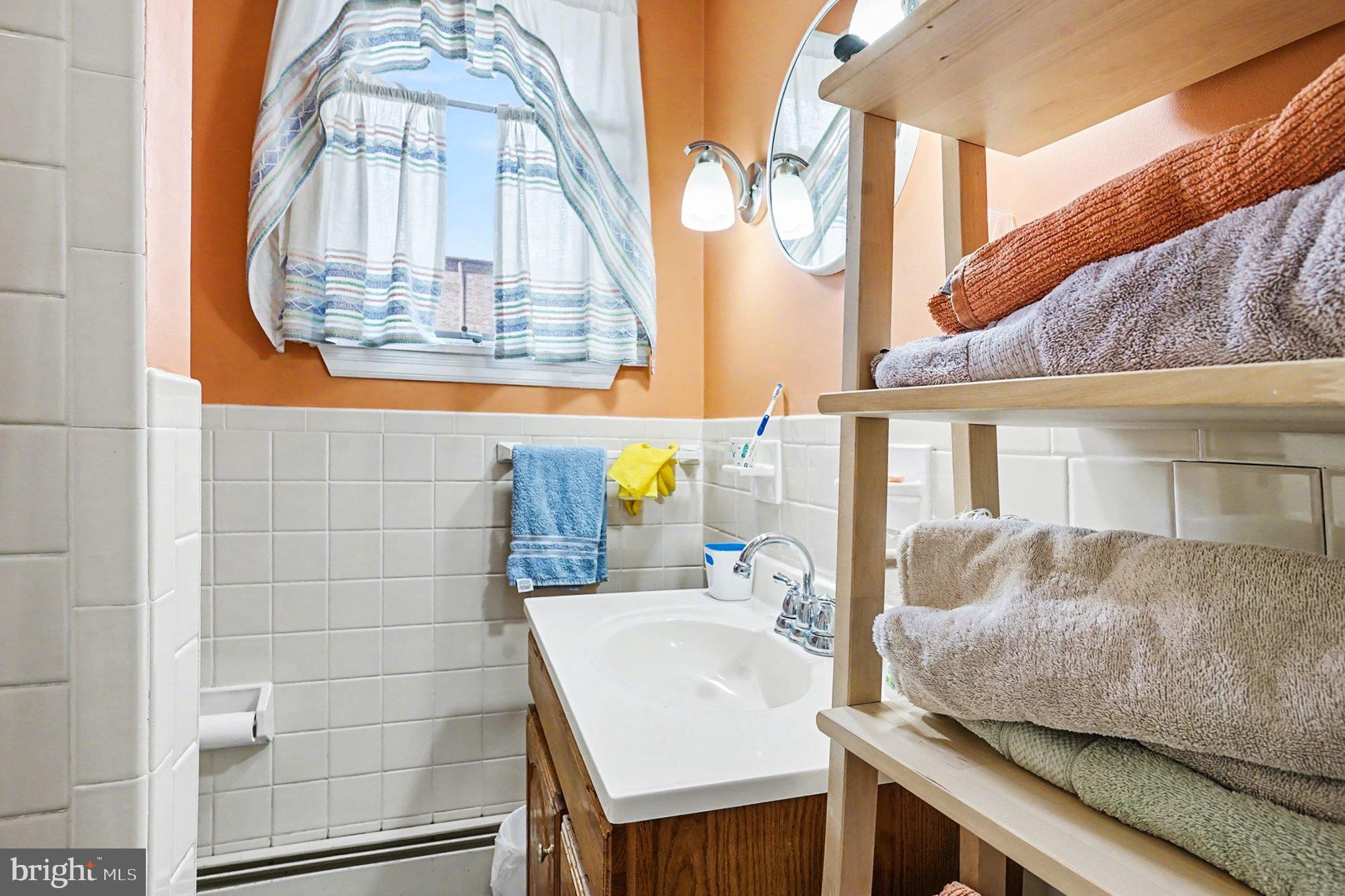 4031 Vernon Road Drexel Hill, PA 19026 - Photo 26 of 38 a living room with a white table and chairs
