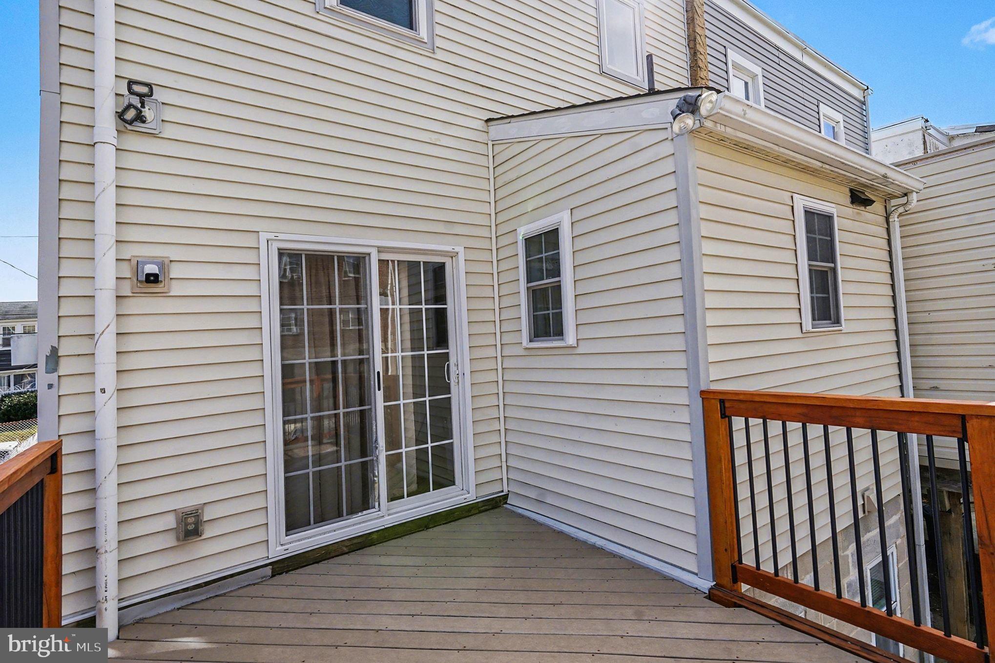 4031 Vernon Road Drexel Hill, PA 19026 - Photo 30 of 38 a view of a white house with wooden walls