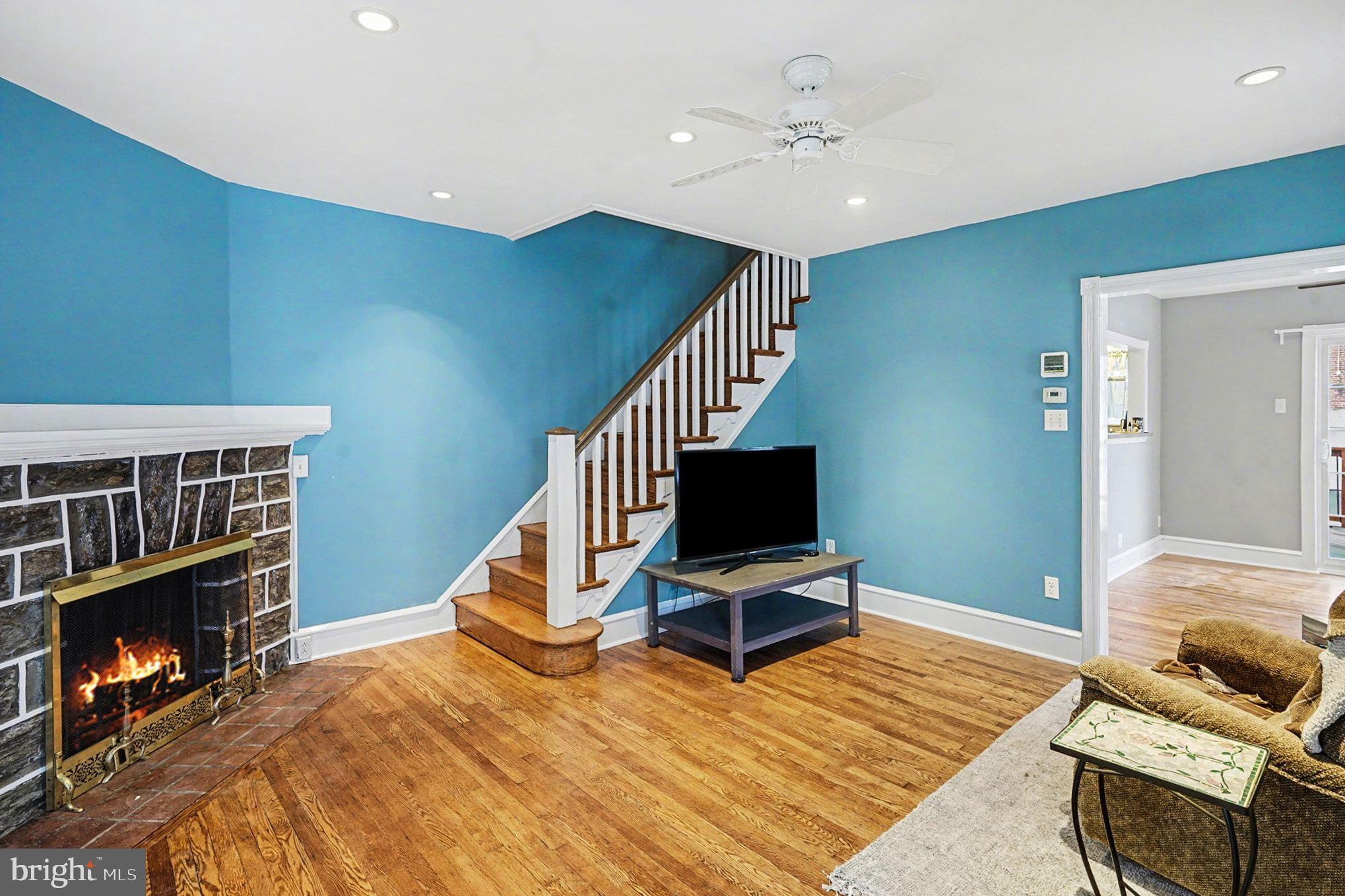 4031 Vernon Road Drexel Hill, PA 19026 - Photo 9 of 38 a bedroom with furniture and a fireplace