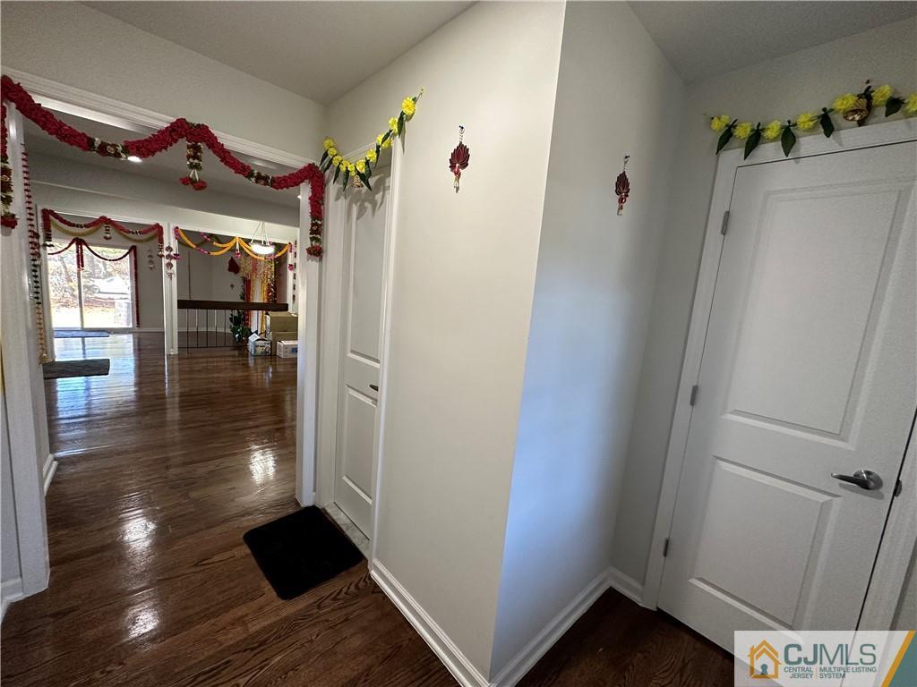 4102 Hana Road Edison, NJ 08817 - Photo 5 of 40 a view of hallway with furniture and wooden floor