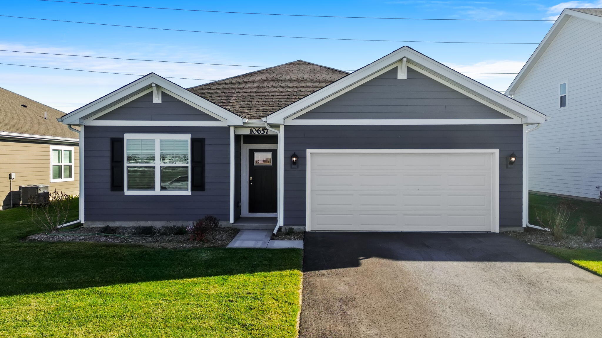 10657 Blaine Street Crown Point, IN 46307 - Photo 24 of 24 a front view of a house with garden