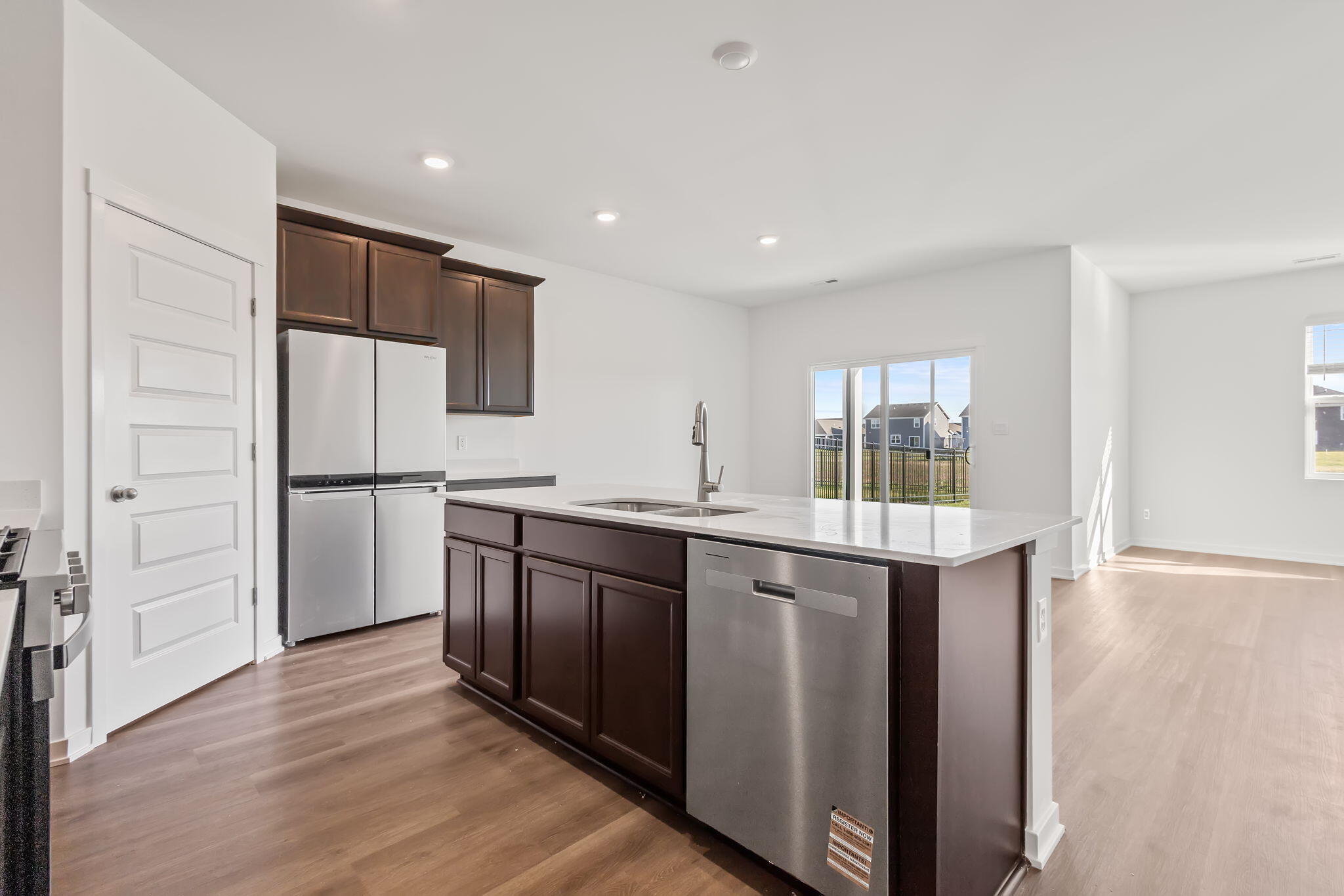 10657 Blaine Street Crown Point, IN 46307 - Photo 4 of 24 a kitchen with stainless steel appliances granite countertop a refrigerator and a sink