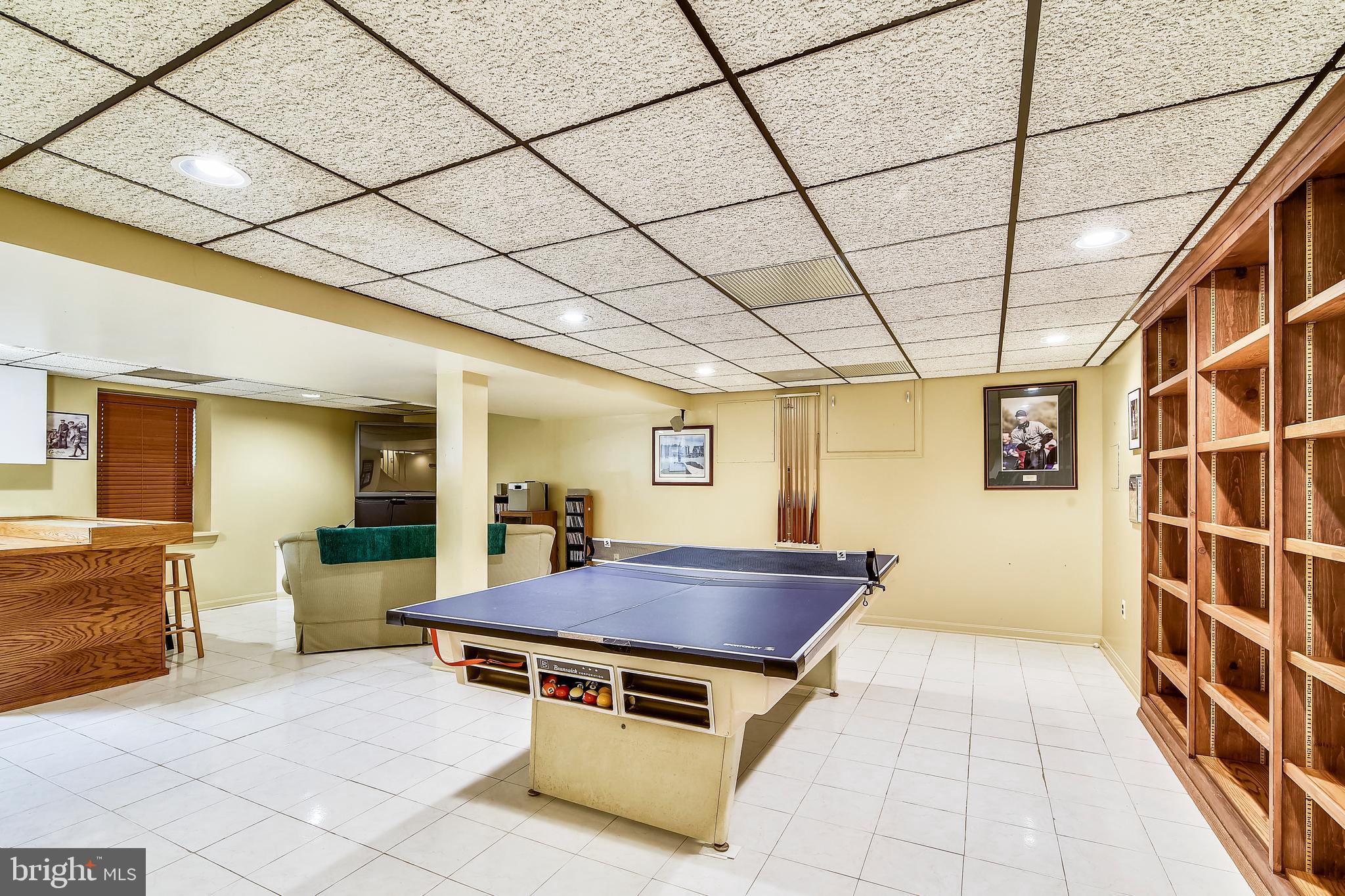 15 Poplar Point Road Edgewater, MD 21037 - Photo 30 of 37 Lower Level Rec Room with wall of built-in shelves