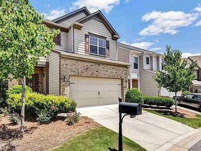 4645 Cold Spring Court Cumming, GA 30041 - Photo 2 of 23 a house with trees in the background