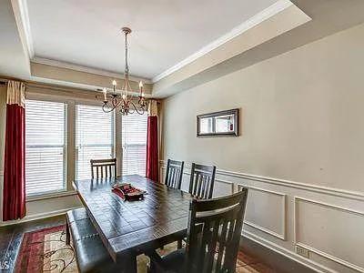 4645 Cold Spring Court Cumming, GA 30041 - Photo 10 of 23 a view of a dining room with furniture window and wooden floor