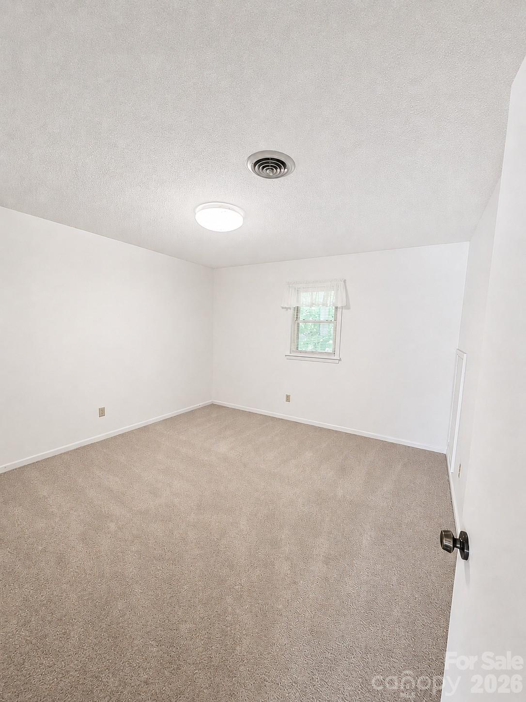 1368 Cajah Mountain Road Hudson, NC 28638 - Photo 41 of 46 an empty room with a windows