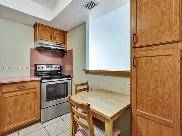 a kitchen with a stove and a microwave
