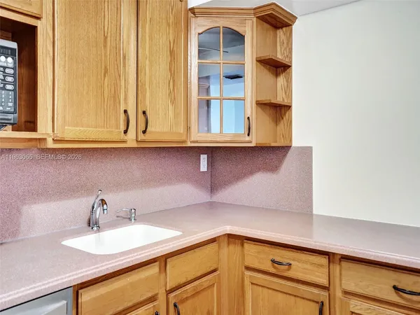 a kitchen with a sink and cabinets