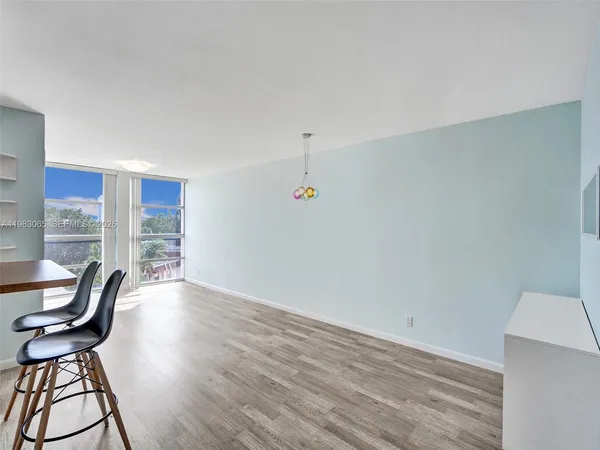 a view of a livingroom with furniture and wooden floor