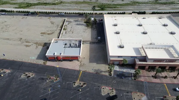 an aerial view of a house with outdoor space