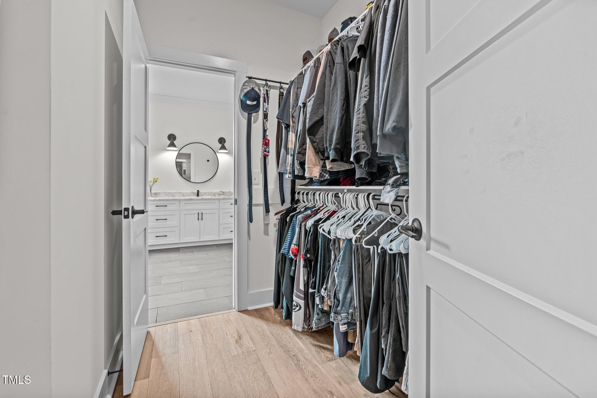 2408 Eddie Howard Road Willow Spring, NC 27592 - Photo 35 of 69 a view of walk in closet with clothes