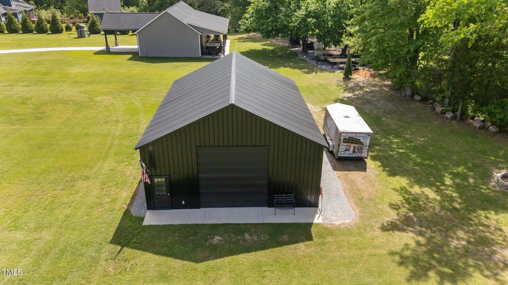 2408 Eddie Howard Road Willow Spring, NC 27592 - Photo 54 of 69 a view of a house with a yard