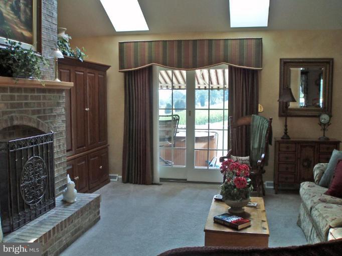 1170 Taylor Road Street, MD 21154 - Photo 8 of 30 Nice size fam. rm. w/cozy custom brick fireplace