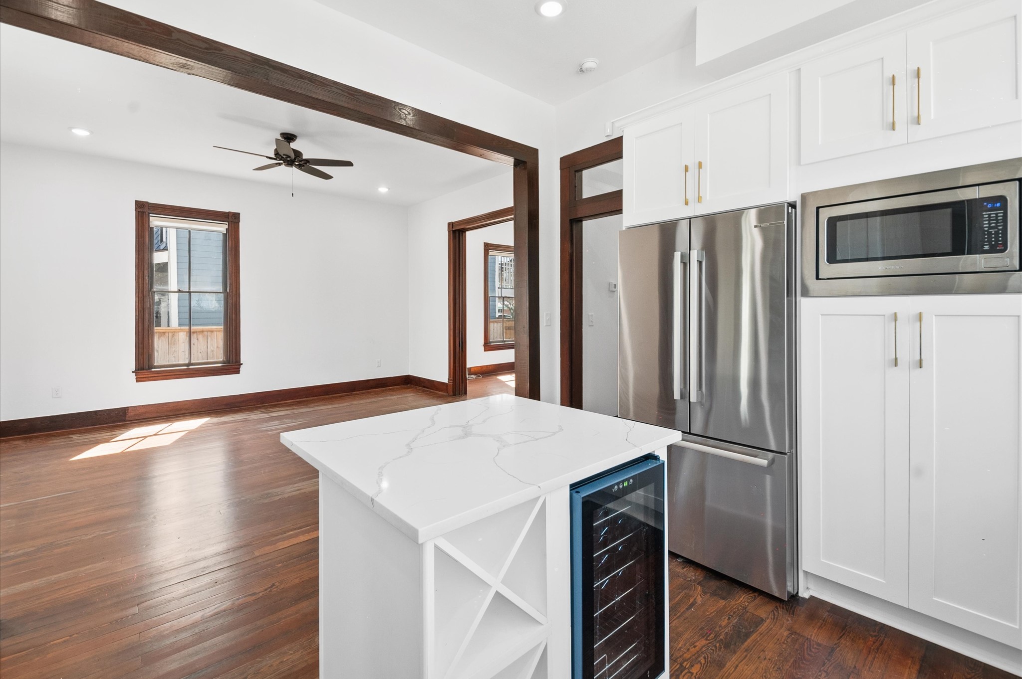 902 9th Street Galveston, TX 77550 - Photo 15 of 38 a kitchen with stainless steel appliances a refrigerator and a stove top oven
