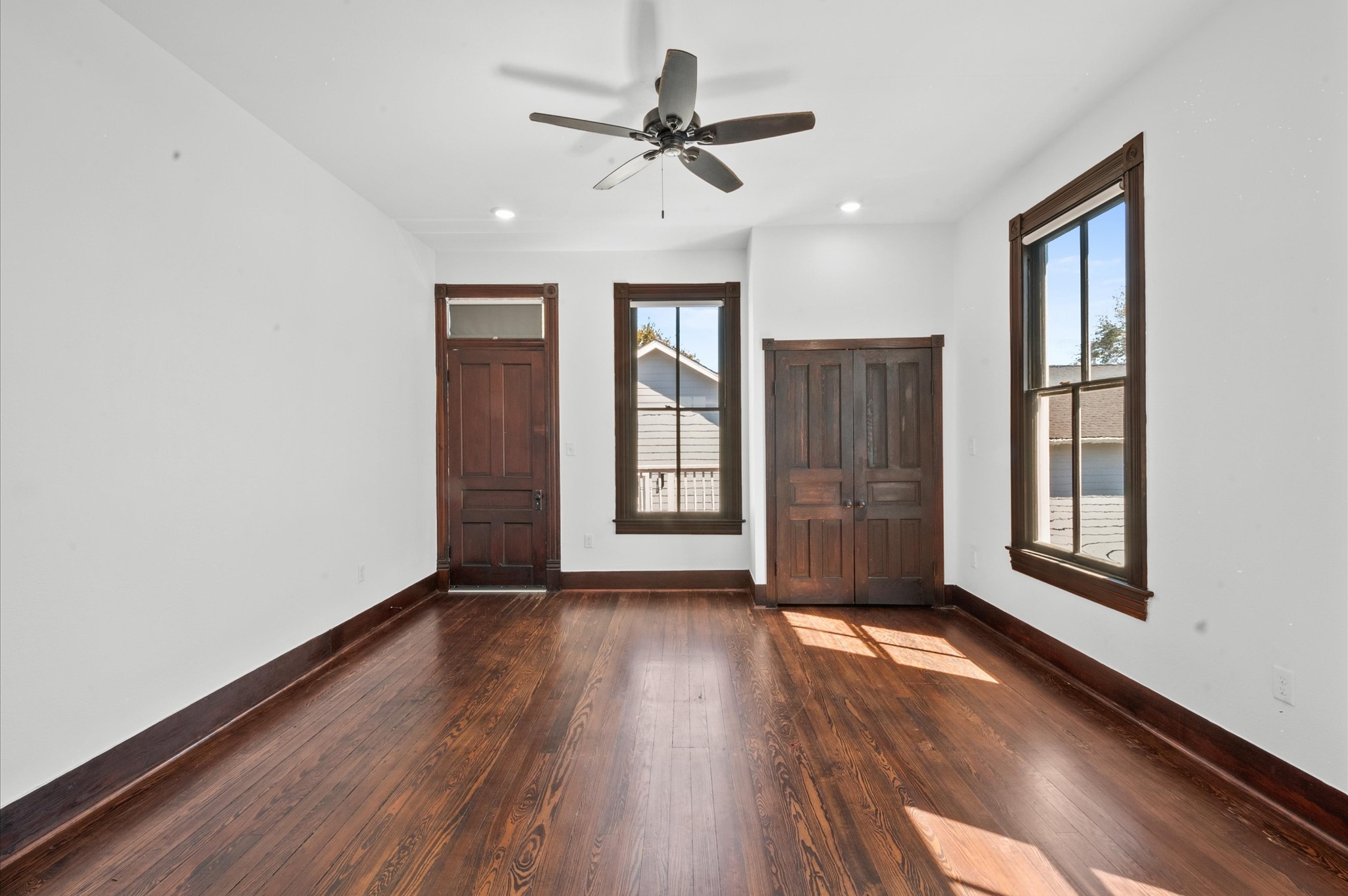 902 9th Street Galveston, TX 77550 - Photo 16 of 38 a view of an empty room with a window and wooden floor