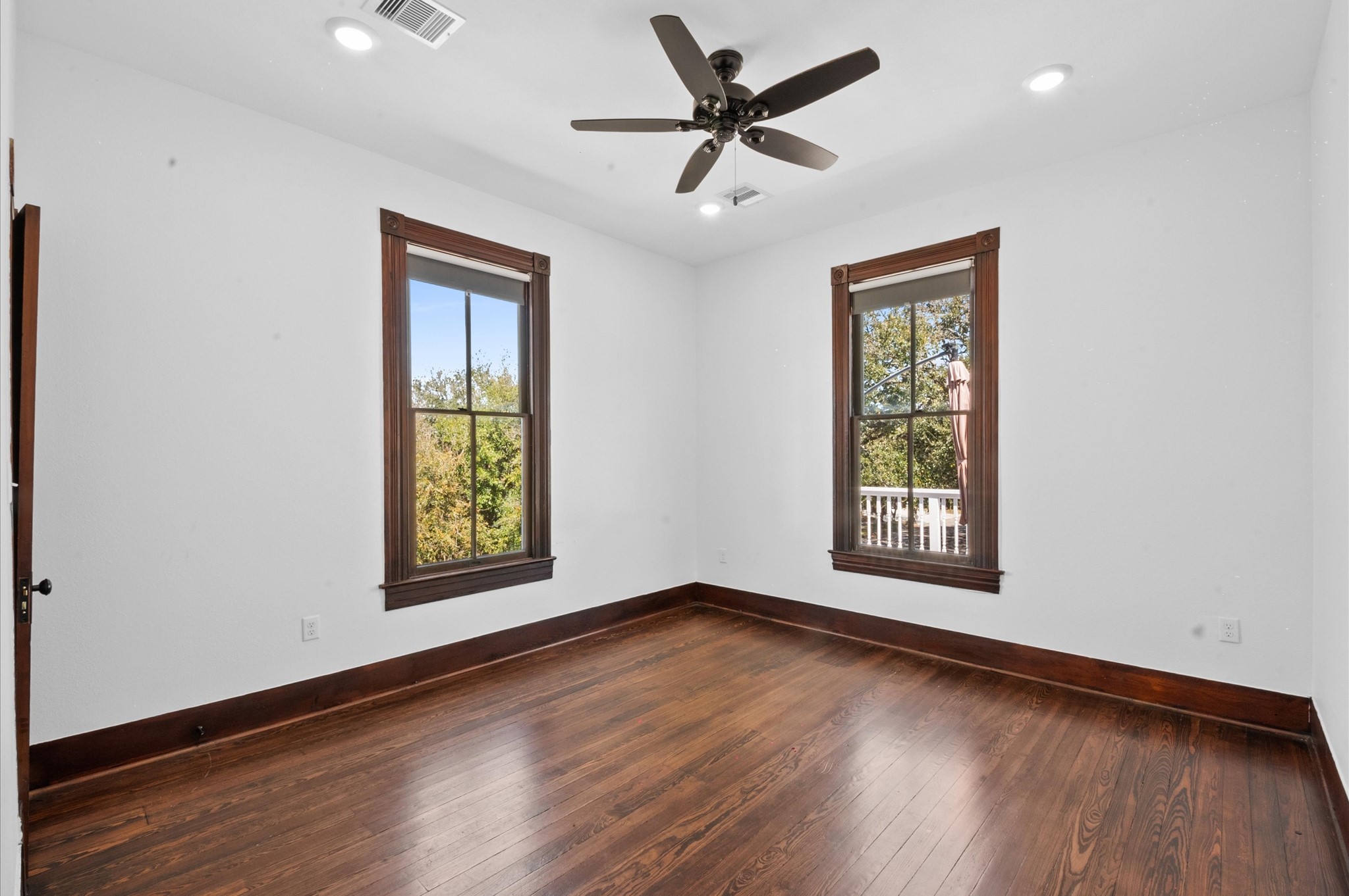 902 9th Street Galveston, TX 77550 - Photo 17 of 38 a view of an empty room with wooden floor and a window