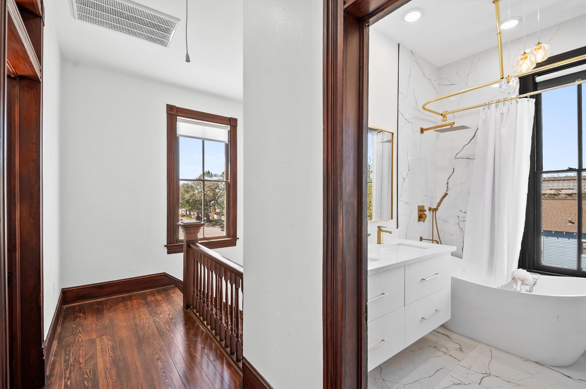 902 9th Street Galveston, TX 77550 - Photo 20 of 38 a view of an entryway with wooden floor and windows
