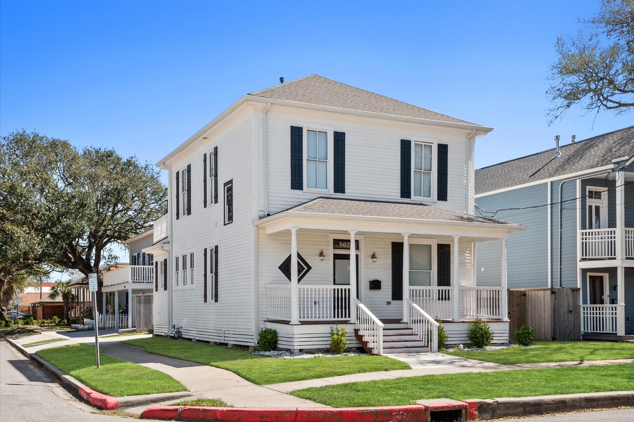 902 9th Street Galveston, TX 77550 - Photo 2 of 38 a front view of a house with a yard