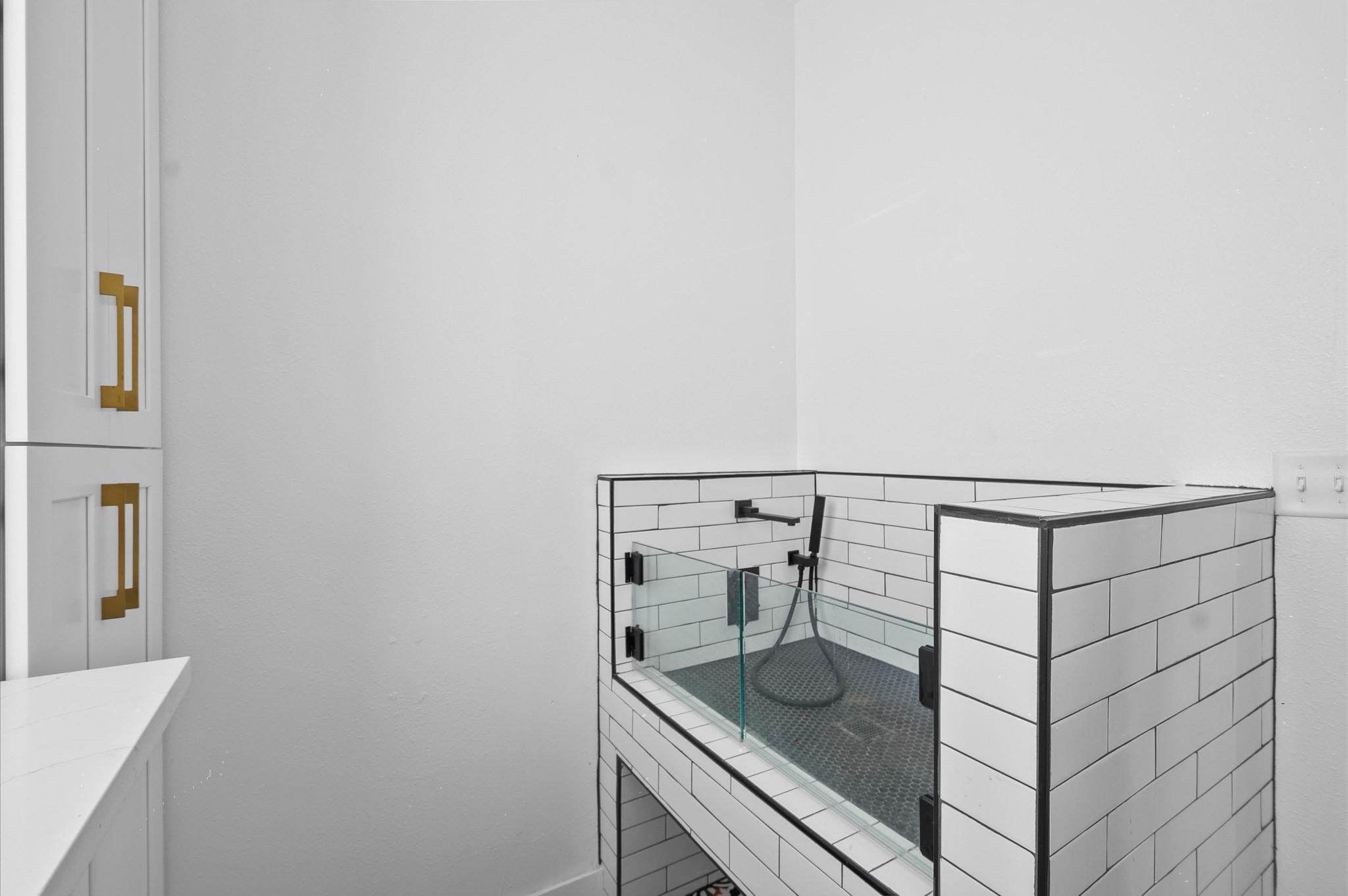 902 9th Street Galveston, TX 77550 - Photo 30 of 38 a bathroom with a sink and mirror