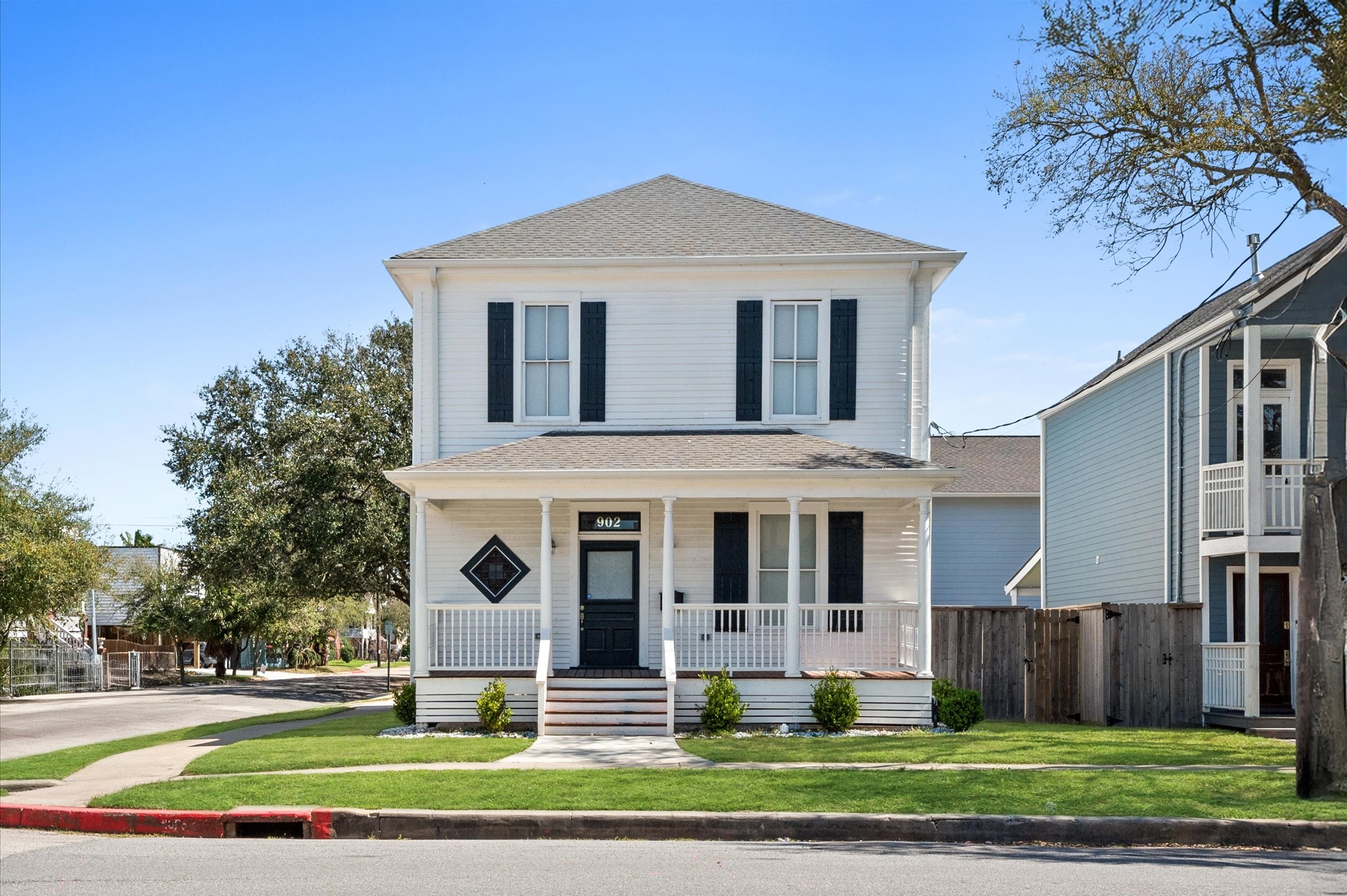 902 9th Street Galveston, TX 77550 - Photo 32 of 38 a front view of a house with a yard