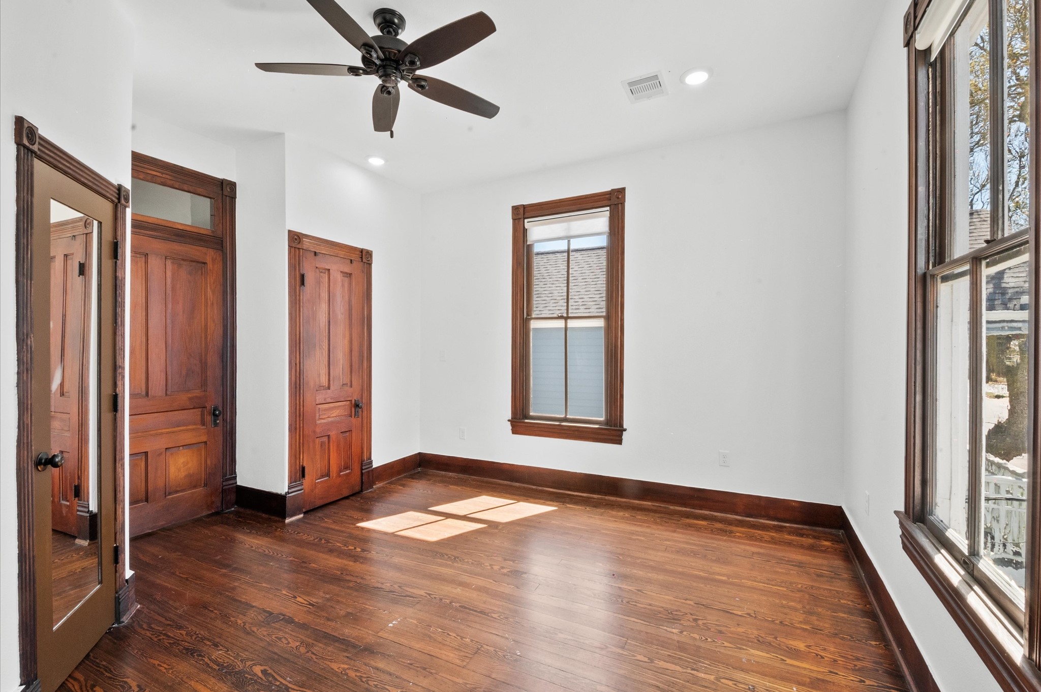 902 9th Street Galveston, TX 77550 - Photo 5 of 38 wooden floor in an empty room with a window