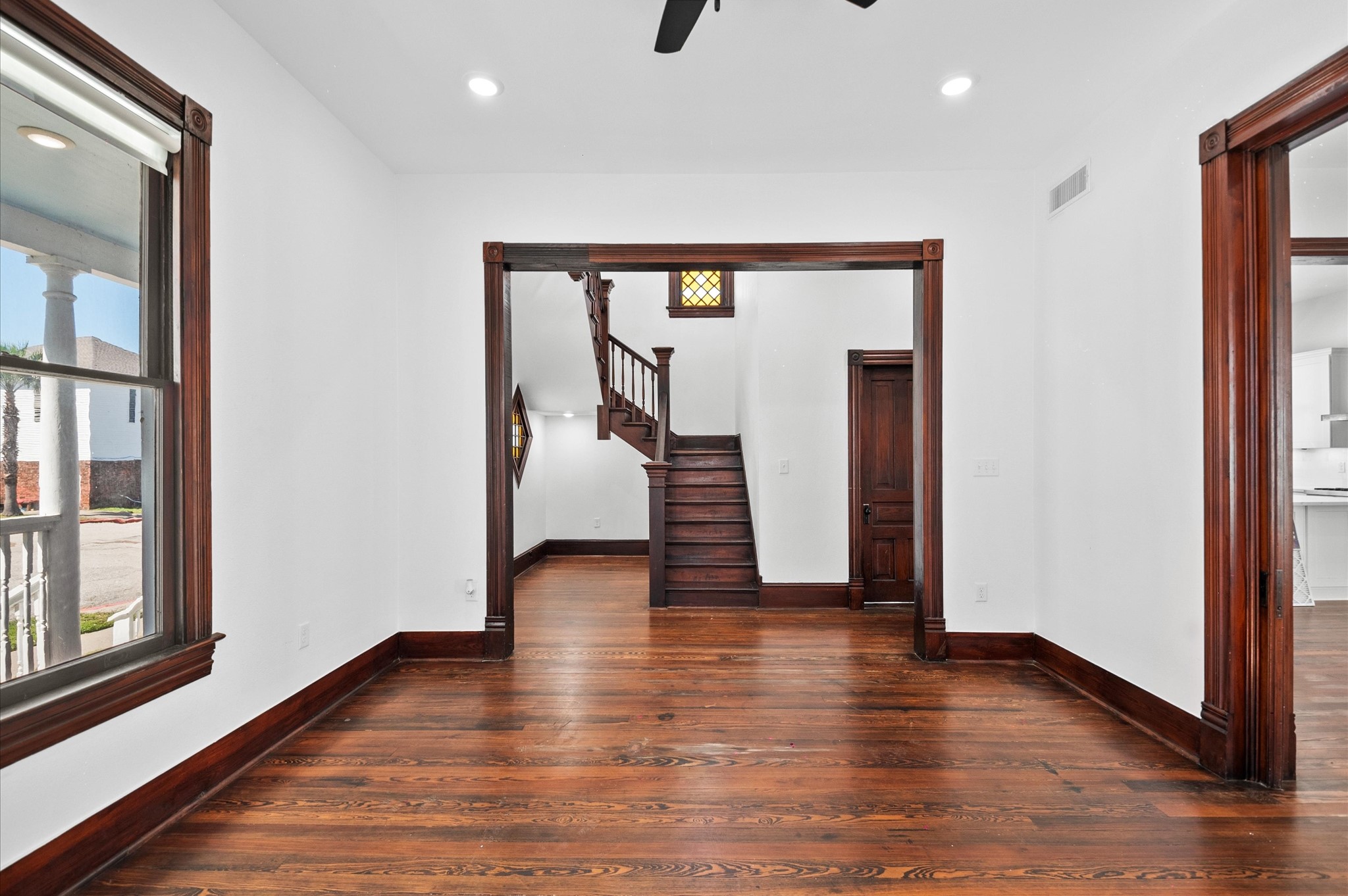 902 9th Street Galveston, TX 77550 - Photo 7 of 38 a view of hallway with stairs and wooden floor